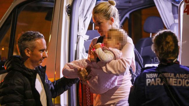 The relieved couple and their baby after the ordeal in Llewellyn Street, Balmain. Picture: Dean Asher