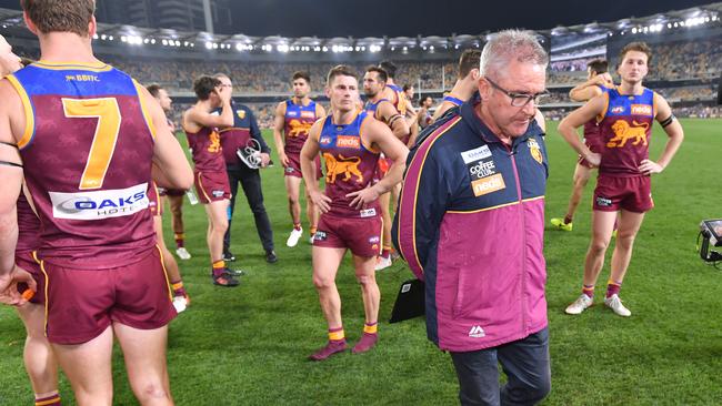 Dejected Brisbane players and coach Chris Fagan after their semi-final loss to GWS. Picture: AAP