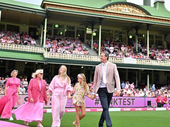 Australiaâs former cricketer Glenn McGrath (R) arrives with his family members to pick up pink caps from the players on Jane McGrath Day during day three of the Third cricket Test match between Australia and Pakistan at Sydney Cricket Ground on January 5, 2024 in Sydney. (Photo by Saeed KHAN / AFP)