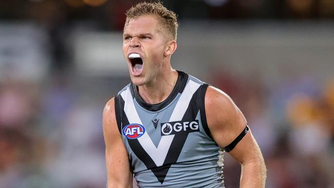 BRISBANE, AUSTRALIA - MARCH 19: Dan Houston of the Power celebrates a goal during the 2022 AFL Round 01 match between the Brisbane Lions and the Port Adelaide Power at The Gabba on March 19, 2022 In Brisbane, Australia. (Photo by Russell Freeman/AFL Photos)