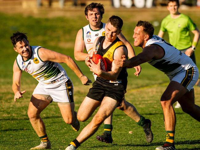 Kobi Russell surrounded by Salisbury Players at the Broadview v Salisbury North clash at Broadview Oval in Adelaide, Saturday, August 29, 2020. (The Advertiser/ Morgan Sette)