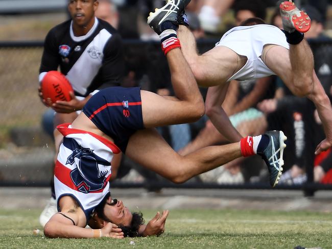 Patrick Singh (Highett) and Daniel Spence (Oakleigh District) take a spill at Turner Rd.