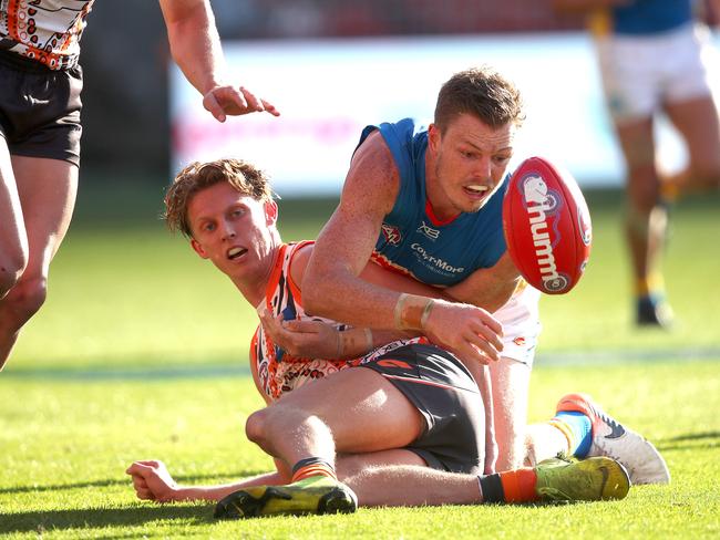 Giants Lachie Whitfield and the Suns Nick Holman during AFL match between the GWS Giants and Gold Coast Suns at Giants Stadium. Picture. Phil Hillyard