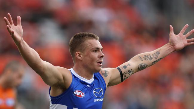 SYDNEY, AUSTRALIA - MARCH 16: Cameron Zurhaar of the Kangaroos celebrates kicking a goal during the round one AFL match between Greater Western Sydney Giants and North Melbourne Kangaroos at ENGIE Stadium on March 16, 2024 in Sydney, Australia. (Photo by Jason McCawley/AFL Photos/via Getty Images )