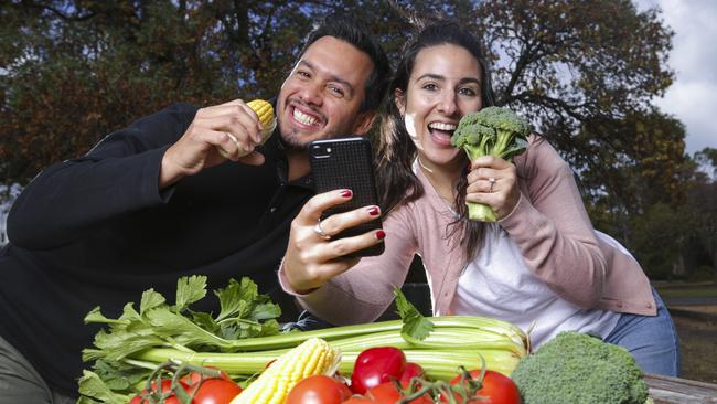 Rodrigo Melendez and Carla Eustathiou tuck into their vegies. Picture: Wayne Taylor