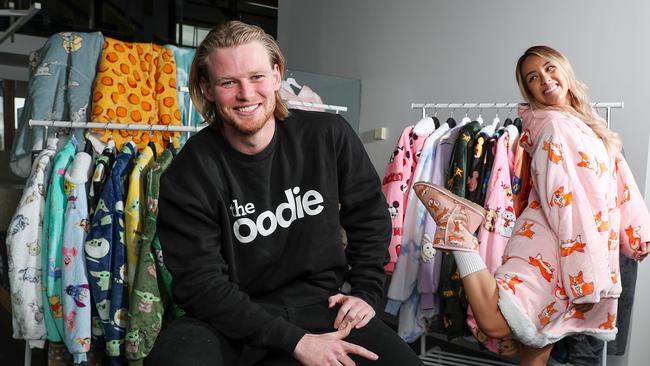 Davie Fogarty is behind brands such as The Oodie. He is pictured here with social media manager Linda Huynh. Picture: Sarah Reed