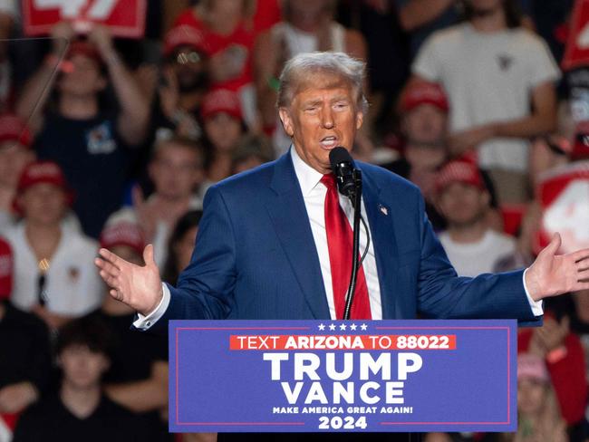 (FILES) Former US President and Republican presidential candidate Donald Trump speaks during a campaign rally at Mullet Arena in Tempe, Arizona on October 24, 2024. Donald Trump won the state of Arizona in this week's US presidential election, US TV networks projected on November 9, 2024, completing the Republican's sweep of all seven swing states. (Photo by Rebecca NOBLE / AFP)