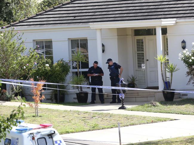 Police at the Geelong home. Picture: Mike Dugdale