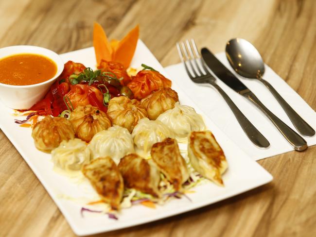 The momo platter ($20) includes chicken or vegetarian dumplings steamed, pan-fried and tossed in an onion, capsicum and chilli sauce. Picture: MATT THOMPSON