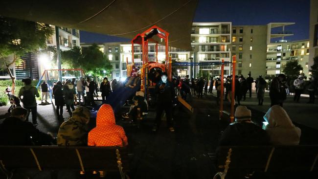 Pictured at a children's play area in Rhodes are Pokemon Go players standing together playing in 10 degrees. Picture: Richard Dobson