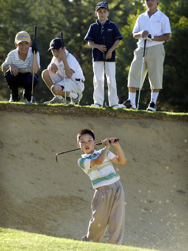 Min Woo hits out of the bunker as an eight-year-old at the Royal Fremantle Golf Club. Picture: Richard Hatherly