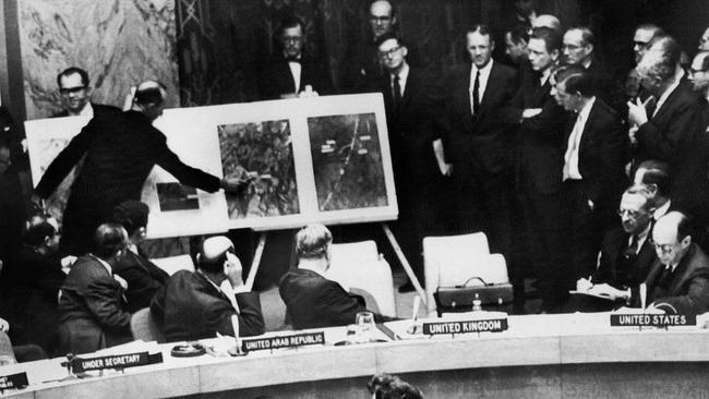 US administration official showing aerial views of one of the Cuban medium-range missile bases, taken October 1962.