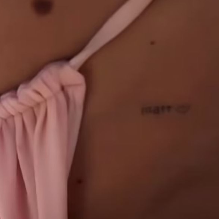 Her ‘Matt’ tattoo was exposed by her skimpy bikini. Picture: Instagram/TammyHembrow