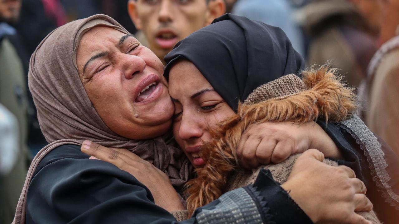 Women mourn as they wait to collect the bodies of friends and relatives killed in an air strike on December 25, 2023 in Khan Yunis, Gaza. Picture: Ahmad Hasaballah/Getty Images