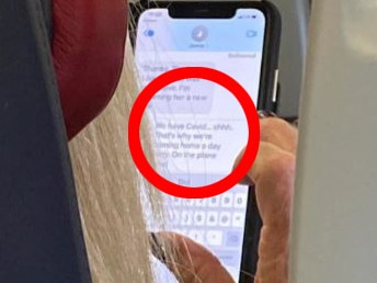 A female passenger divided critics on Reddit after purporting to spot a fellow passenger’s text, in which they claimed to have contracted Covid-19. Picture: Reddit
