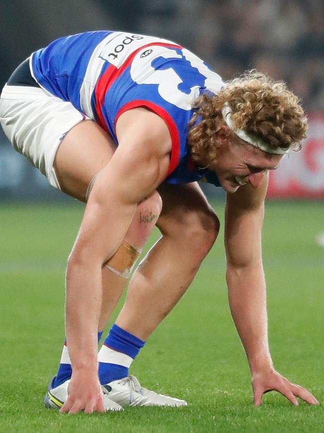 Bulldogs spearhead Aaron Naughton struggles to his feet. Picture: AFL Photos via Getty Images