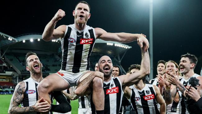 Adams celebrates after his 200th game against the Power. Picture: Mark Brake/Getty Images