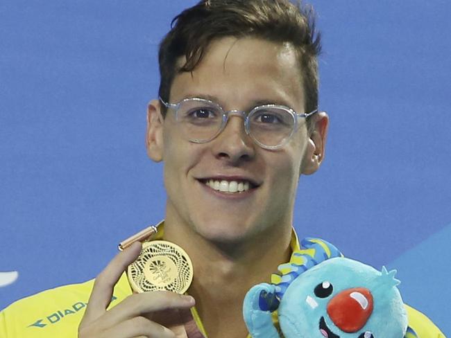 Australia's Mitch Larkin shows his medal after winning gold in the men's 200m backstroke finals at the Aquatic Centre during the 2018 Commonwealth Games on the Gold Coast, Australia, Monday, April 9, 2018. (AP Photo/Rick Rycroft)