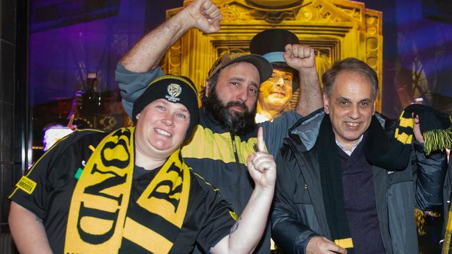 Richmond fans queuing at Ticketek ahead of next weeks finals match. From left, Kirsty Upjohn, Frank Borg and Greg Moschoyiannis in the queue. Picture: Sarah Matray