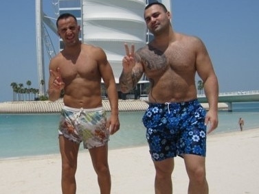 Former Comanchero Hakan ‘Little Hux’ Arif with Hakan Ayik on a Dubai beach.