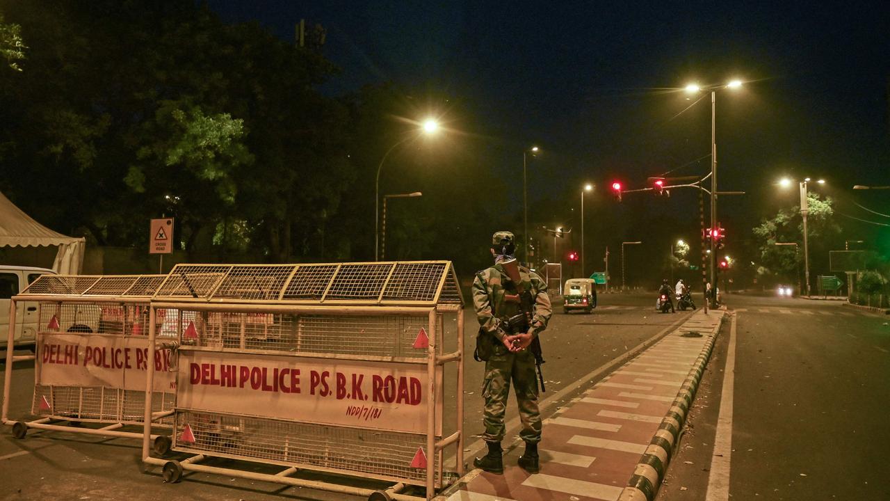 A security guard at a roadblock during a lockdown imposed in New Delhi. Picture: Tauseef Mustafa / AFP.