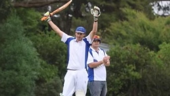 Record breaker: Ben King raises his bat on Saturday. Picture: Jorja Gay