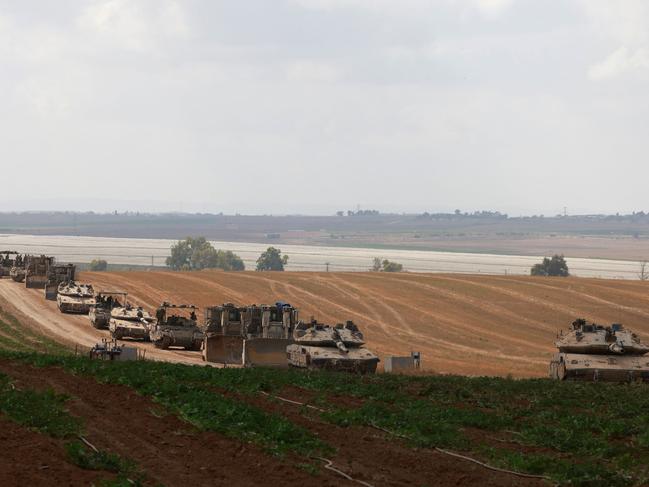 Israeli military vehicles roll near the border with the Gaza Strip on May 12. Picture: Menahem Kahana/AFP