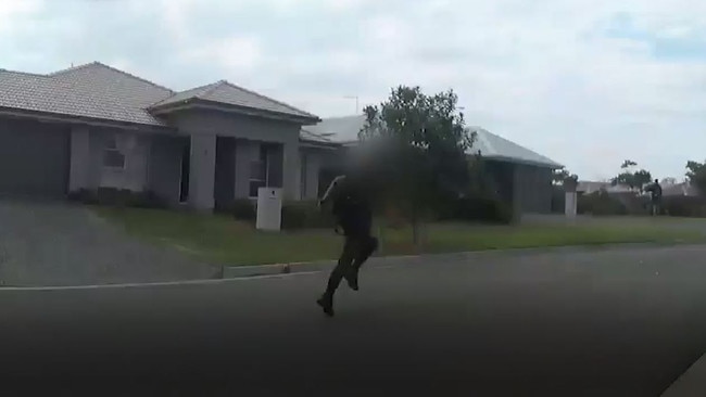 A suspect tries to run from police officers.