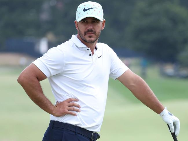 LIV Golf recruit Brooks Koepka leans on his club during the US Open, at which he was still being coy about his career plans. Picture: Warren Little/Getty Images/AFP