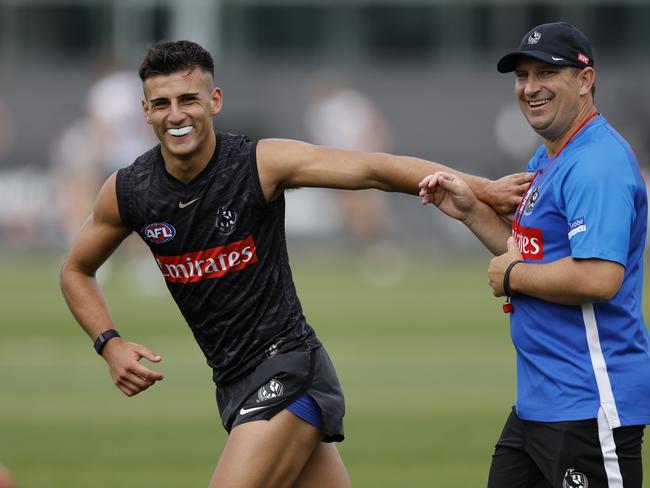 Nick Daicos of the Magpies has a laugh with assistant coach Hayden Skipworth during todays training session in 2024. Picture: Michael Klein