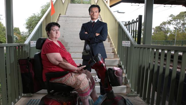 Macquarie Fields resident Rosemary Hoy and local MP Anoulack Chanthivong are lobbying the State Government to install a lift at Macquarie Fields railway station. Picture: Robert Pozo