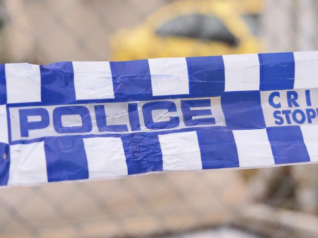 Blue and white Police tape cordoning off a area with a yellow car at a industrial area, Australia 2016 Police tape cordoning off a area with a yellow car - Stock image ipad generic