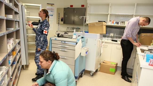 Royal Australian Air Force and Tasmanian Health Pharmacists replenish stores in the North West Regional Hospital in Burnie Tasmania.