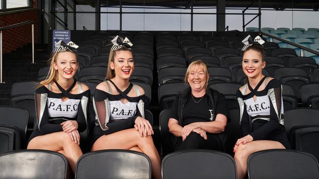 Cheerleaders Zenya Lodenstein, Gabriella Ward and Abbey Harby with choreographer, Gaynor Palmer. Picture: Matt Loxton