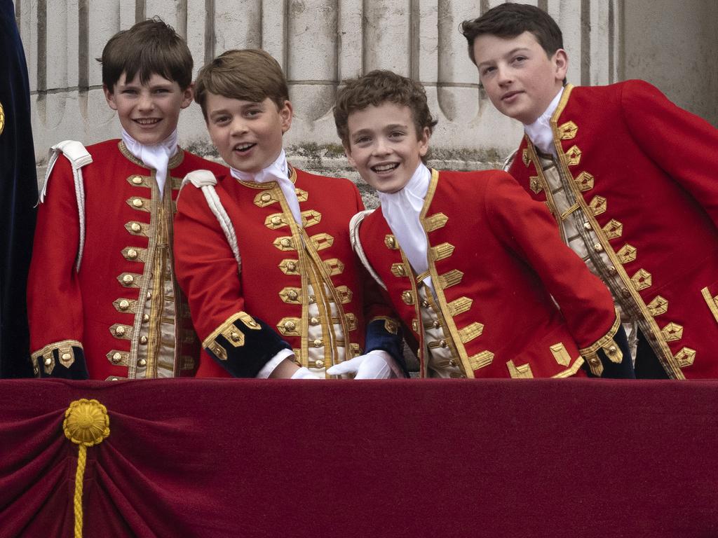 Pages Lord Oliver Cholmondeley, Prince George of Wales, Nicholas Barclay and Ralph Tollemache on the Buckingham Palace balcony. Picture: Getty