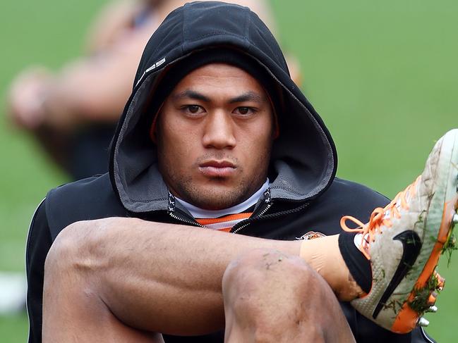 (FILE) MARCH 9, 2017 - The NRL has terminated the registration of Wests Tigers player Tim Simona over various betting scandals. SYDNEY, AUSTRALIA - JULY 15: Tim Simona stretches during a Wests Tigers NRL training session at Concord Oval on July 15, 2014 in Sydney, Australia. (Photo by Renee McKay/Getty Images)