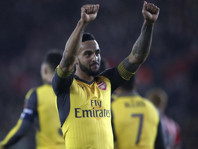 Arsenal's Theo Walcott celebrates scoring his side's fourth goal against Southampton during the Emirates FA Cup, fourth round soccer match at St Mary's Stadium, Southampton, England, Saturday Jan. 28, 2017. (Nick Potts/PA via AP)