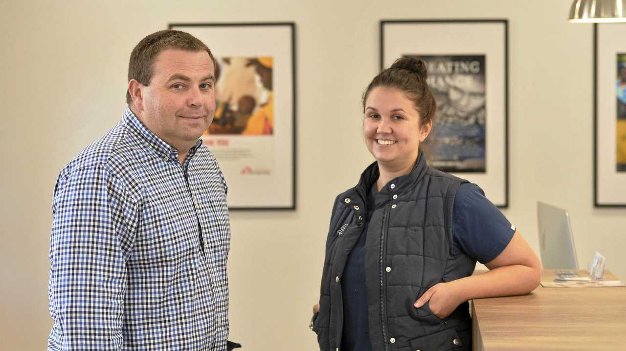 HELPING HAND: Dr Tom Smith and vet nurse Bec Lewis of Toowoomba Family Vets flew to Papua New Guinea for an emergency surgery to help a pet dog that had been run over by a car. Picture: Kevin Farmer