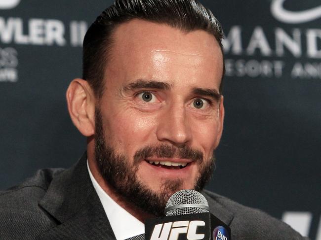 Former WWE professional wrestler CM Punk speaks at a news conference following UFC 181 after signing a contract with the UFC Saturday, Dec. 6, 2014 at the Mandalay Bay Events Center in Las Vegas. (AP Photo/Las Vegas Review-Journal, Sam Morris) LOCAL TELEVISION OUT; LOCAL INTERNET OUT; LAS VEGAS SUN OUT