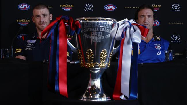 PERTH.  24/09/2021. Simon Goodwin, senior coach of the Demons and captain Max Gawn along side Luke Beveridge , Senior Coach of the Bulldogs and captain  Marcus Bontempelli at this morning press conference at Kings Park, Perth . Photo by Michael Klein