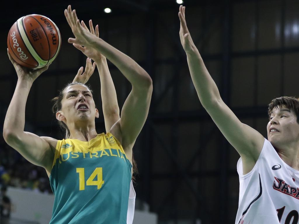 Australia center Marianna Tolo (14) shoots as Japan forward Ramu Tokashiki defends during the first half of a women's basketball game at the Youth Center at the 2016 Summer Olympics in Rio de Janeiro, Brazil, Thursday, Aug. 11, 2016. (AP Photo/Carlos Osorio)