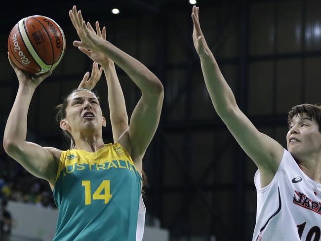 Australia center Marianna Tolo (14) shoots as Japan forward Ramu Tokashiki defends during the first half of a women's basketball game at the Youth Center at the 2016 Summer Olympics in Rio de Janeiro, Brazil, Thursday, Aug. 11, 2016. (AP Photo/Carlos Osorio)