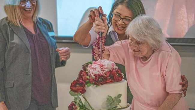 CONGRATS: Isabell Webb, 102, cuts the cake. Picture: Contributed