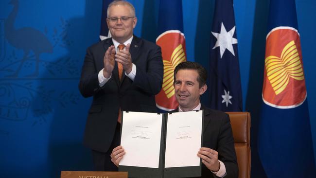 Scott Morrison with Trade Minister Senator Simon Birmingham and the Regional Comprehensive Economic Partnership trade deal in Parliament House in Canberra on Sunday. Picture: Gary Ramage