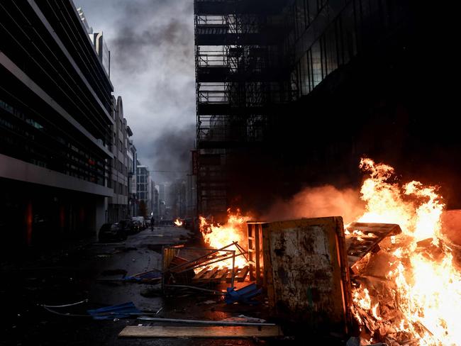 Wood pallets are burning on a street in Brussels. Picture: AFP