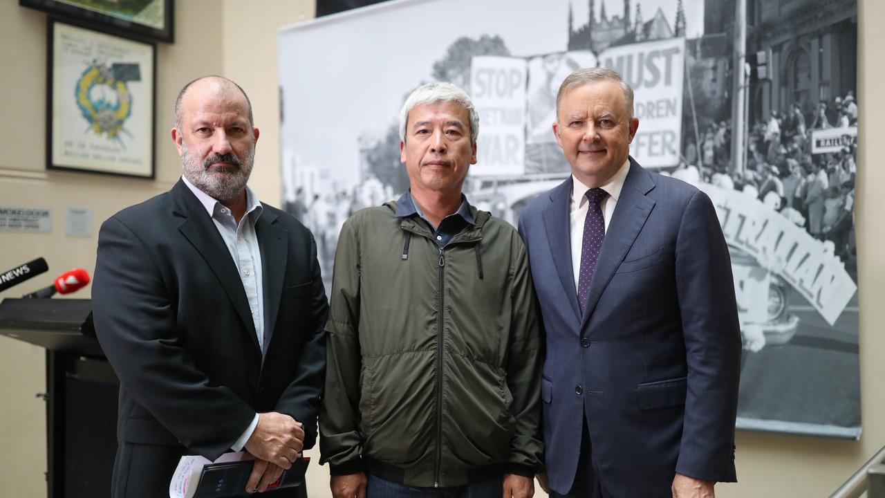 Unions NSW Secretary Mark Morey, farm worker Wang Xueliang and Labor leader Anthony Albanese presented the report on Tuesday. Picture: NCA NewsWire / Christian Gilles