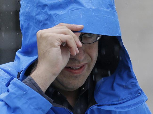 Subway restaurant spokesman Jared Fogle walks to a waiting car as he leaves his home, Tuesday, July 7, 2015, in Zionsville, Ind. FBI agents and Indiana State Police have removed electronics from the property. FBI Special agent Wendy Osborne said that the FBI was conducting an investigation in the Zionsville area but wouldn't confirm it involved Fogle. (AP Photo/Michael Conroy)