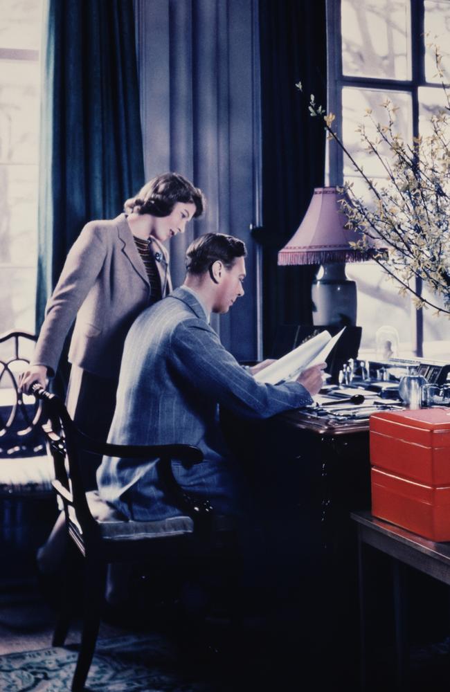 The then Princess Elizabeth talks to her father, King George VI while he goes through the royal boxes at Windsor Castle. Picture: Lisa Sheridan/Studio Lisa/Getty Images