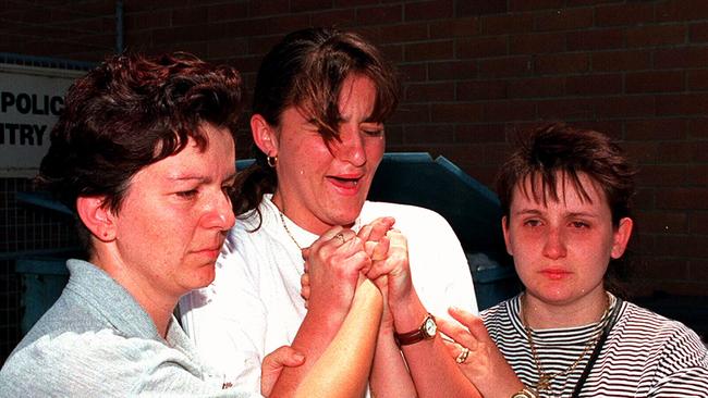 Four days after Gordana went missing her aunt Sonya Simonovich, best friend Belinda Miljkovic and sister Carolina Kotevksi comfort each other on Powell St. Picture: News Corp.