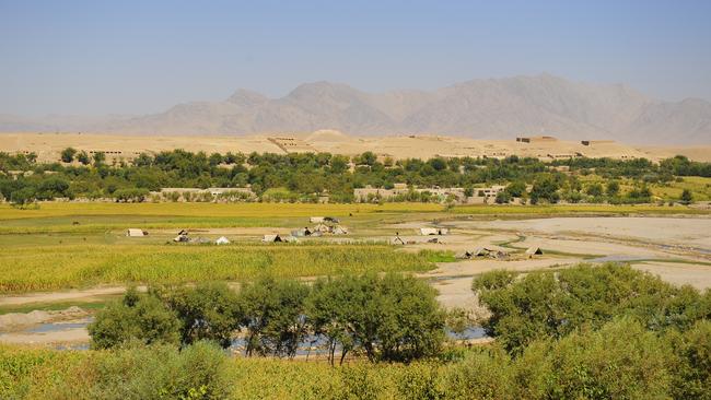 A view of a typical Afghanistan landscape view taken ontop a hill over looking the Green zone in Tarin Kowt, Afghanistan.